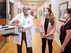 Doctor and administrators talking at a desk