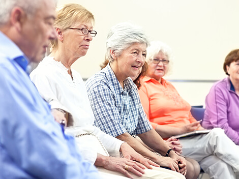 patients sitting in a rehabilitation support group
