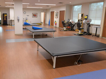 Large mat table in a therapy gym.