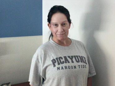 Heather Penton stands proudly after rehabilitation.