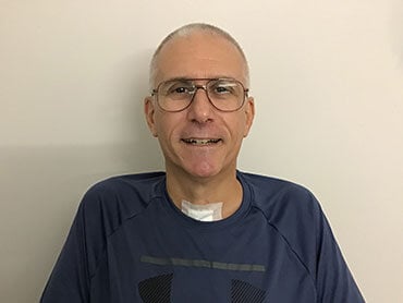 Joseph LaFerriere smiles during therapy.