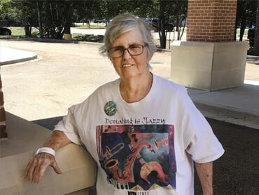 Judith Lacho smiles as she poses outside the hospital.